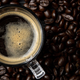 coffee cup on coffee beans